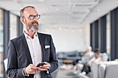 Businessman in office looking away