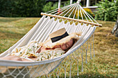 Woman relaxing on hammock