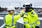 People talking on building site