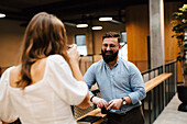 Coworkers talking at corridor