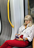 Young woman on the metro in Copenhagen