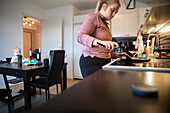 Woman preparing breakfast in kitchen