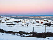 Houses in snowy landscape in archipelago