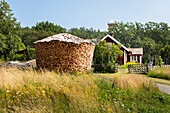 Stack of firewood on meadow