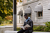 Young man reading documents