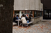 Young friends sitting together