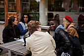 Young friends sitting together