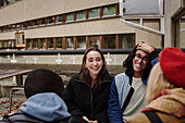 Young friends sitting together