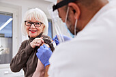 Senior woman getting vaccinated against Covid-19