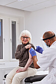 Senior woman getting vaccinated against Covid-19