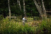 View of boy fishing