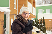 Smiling woman using cell phone