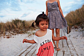 Smiling girl on boardwalk