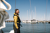 Smiling woman on boat in marina