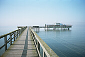 Empty wooden pier and blue sky