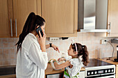 Mother and daughter in kitchen