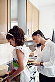 Mother and daughter in kitchen