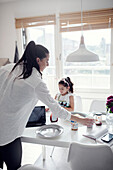 Mother and daughter at dining table