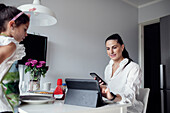 Mother and daughter at dining table