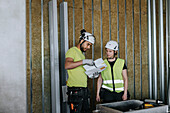 People talking at construction site