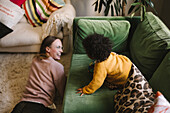 Mother and daughter playing at home