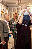 Women with baby in shop