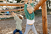 Child playing on climbing frame