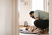 Father with baby on floor