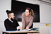 Teachers talking in classroom