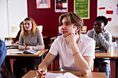 Teenage boy sitting in classroom