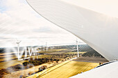 Wind turbines in field