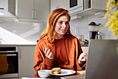 Woman using laptop at home