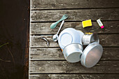 Pots and cutlery on jetty