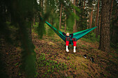 Woman relaxing on hammock