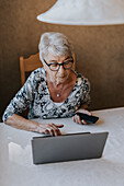 Senior woman using laptop