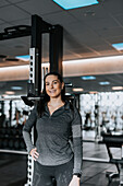 Woman standing in gym