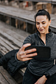 Smiling woman taking selfie