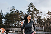 Smiling woman exercising