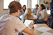 Student using tablet in class