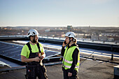 Workers standing on roof