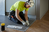 Worker installing floor