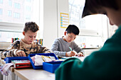 Boy students sitting in classroom