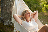 Woman relaxing on hammock