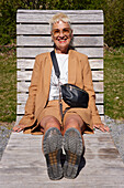 Mature woman relaxing on sun lounger