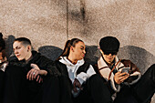 Young friends sitting together