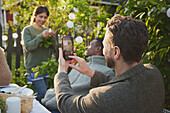 Friends having meal in garden