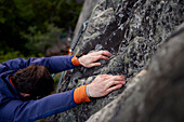 Close-up of man rock climbing