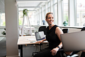 Smiling businesswoman in office