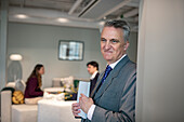 Businessman in office looking away