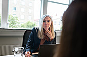 Businesswoman having meeting in office